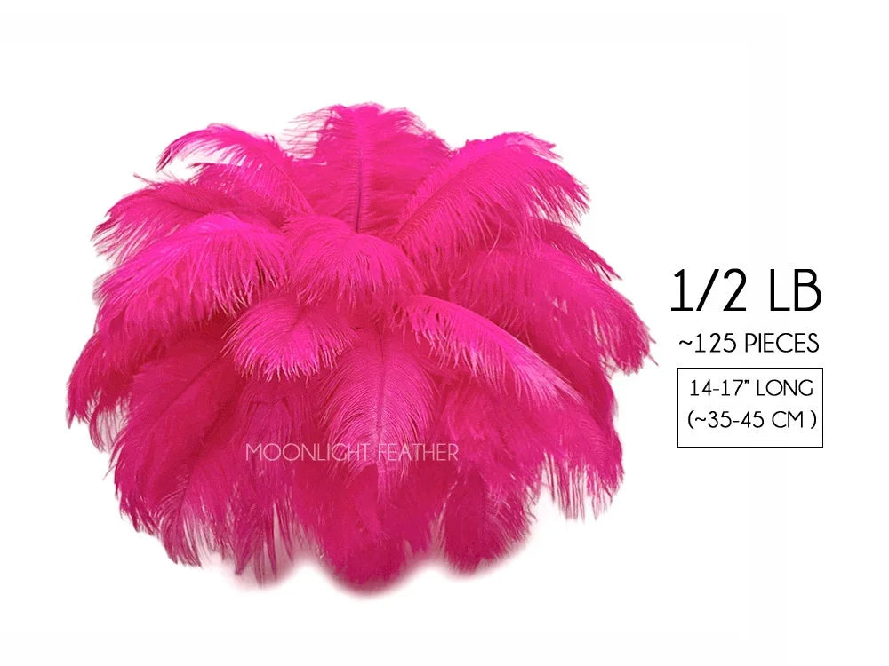 Bulk pack of 125 bright pink ostrich feathers, 14-17 inches long, for crafts and fashion decor.