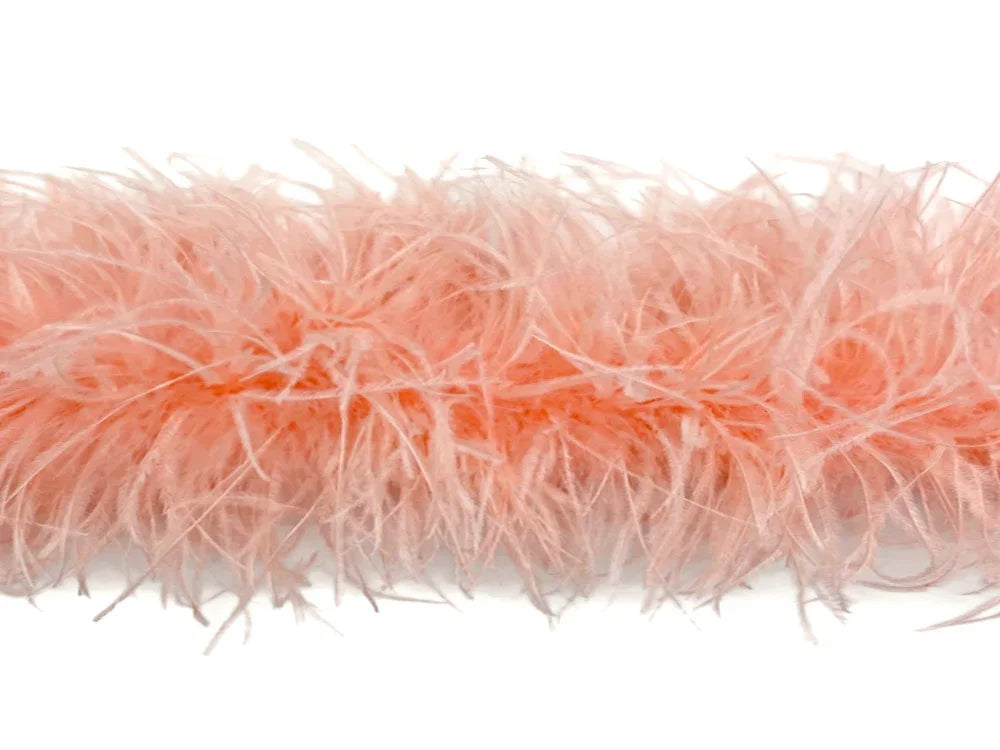 Soft peach pink feather boa trim for crafts and fashion accessories.