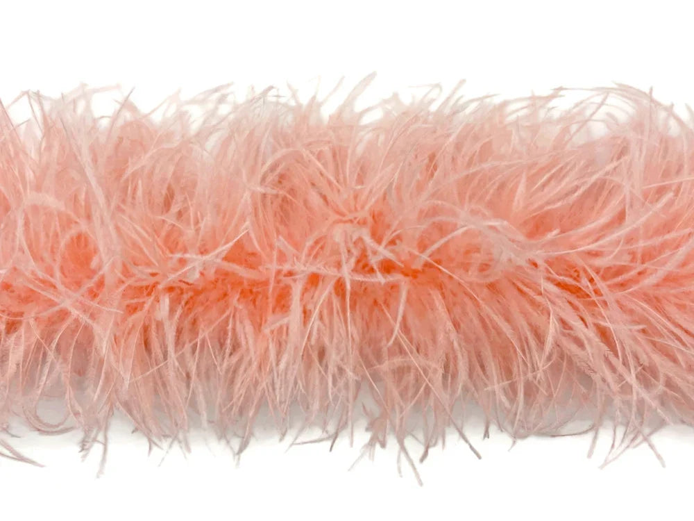 Soft peach colored feather boa for fashion and DIY craft decorations.