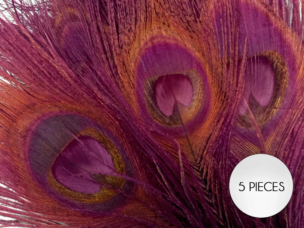 Set of 5 vibrant magenta and gold dyed peacock feathers for crafts and fashion DIY.