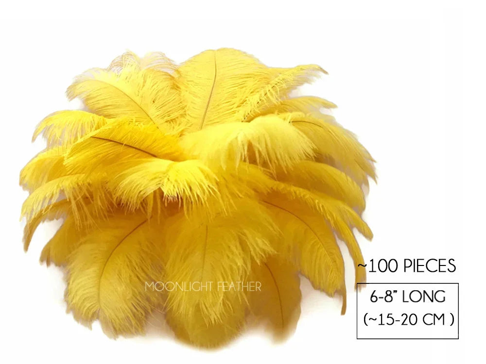 Set of 100 bright yellow ostrich feathers, 6-8 inches long, for DIY crafts and fashion decor.