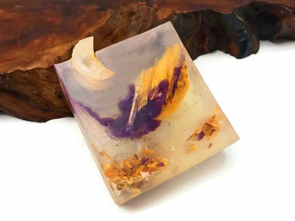 Handmade resin art piece with purple and gold leaf accents and celestial moon details.