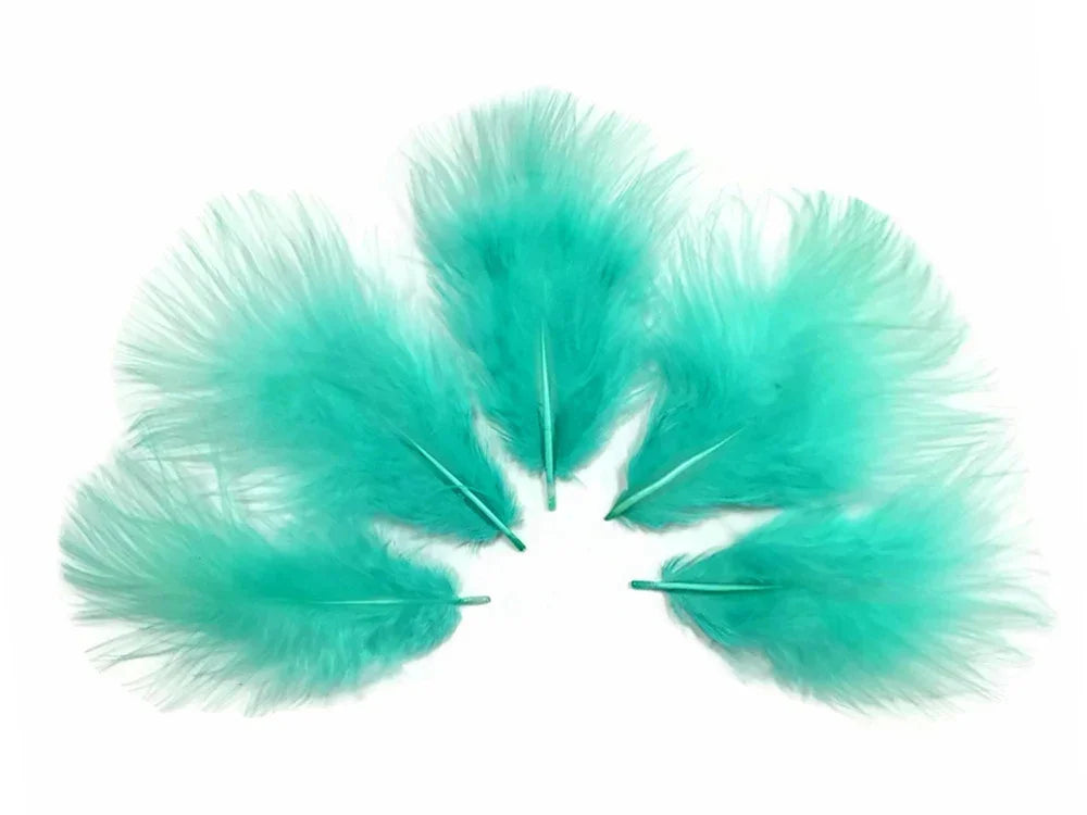 Set of vibrant turquoise teal feathers for DIY crafts and fashion decor.