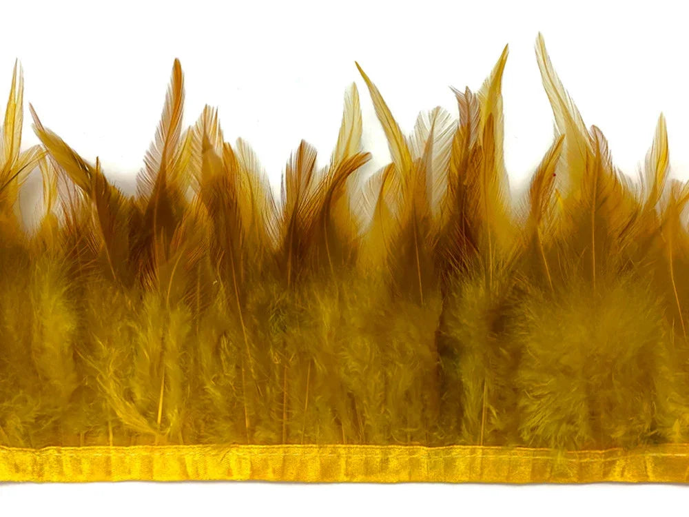 Mustard yellow feather trim strip for fashion and DIY crafts on white background.
