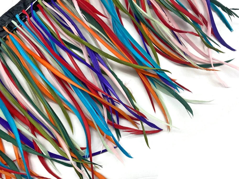 Vibrant multi-colored craft feathers in shades of blue, red, orange, and pink for DIY decor.