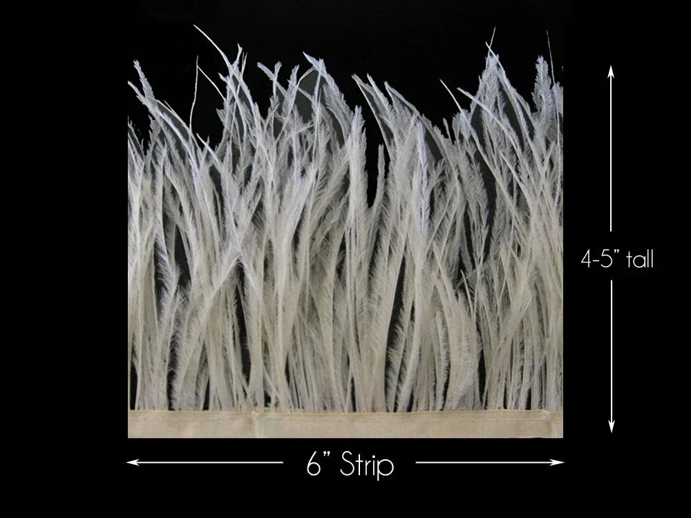 White ostrich feather boa trim strip, 6 inches wide and 4-5 inches tall, on black background