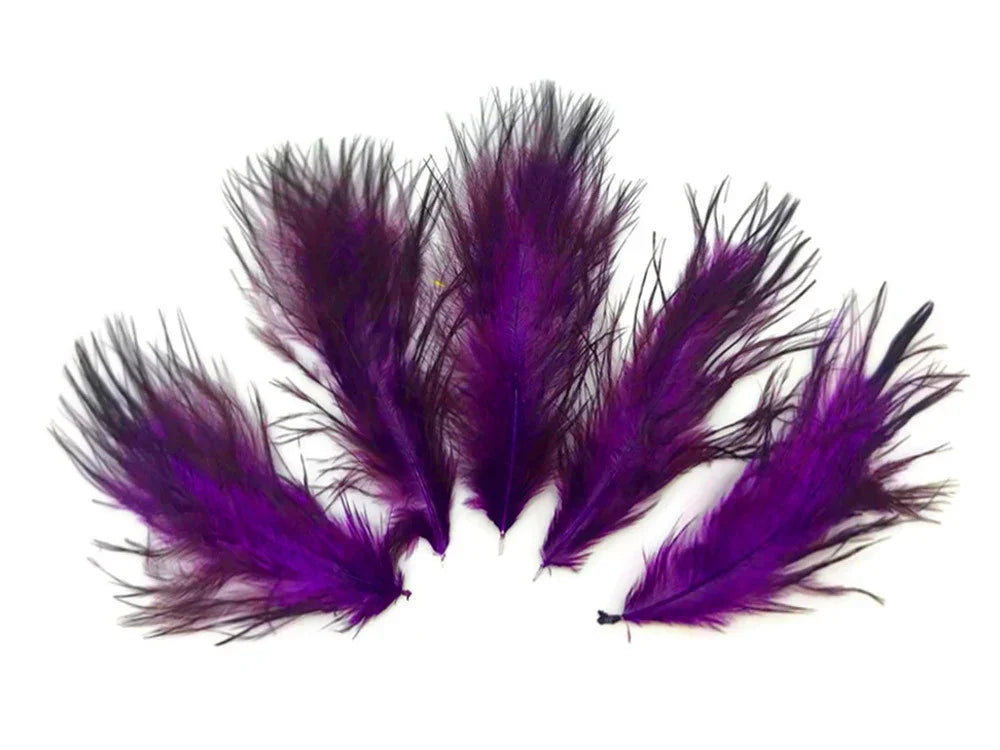 Vibrant purple and black dyed feathers for DIY crafts and fashion accessories.