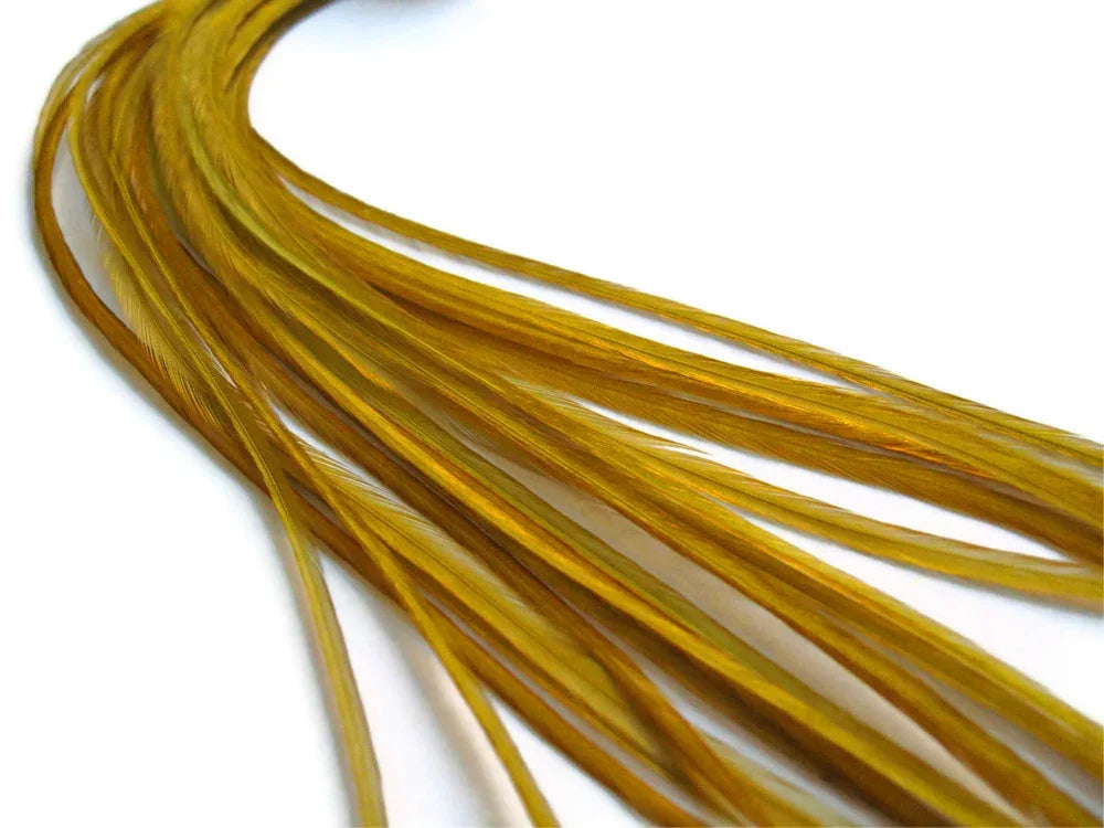 Bundle of long, golden-yellow craft feathers on a white background