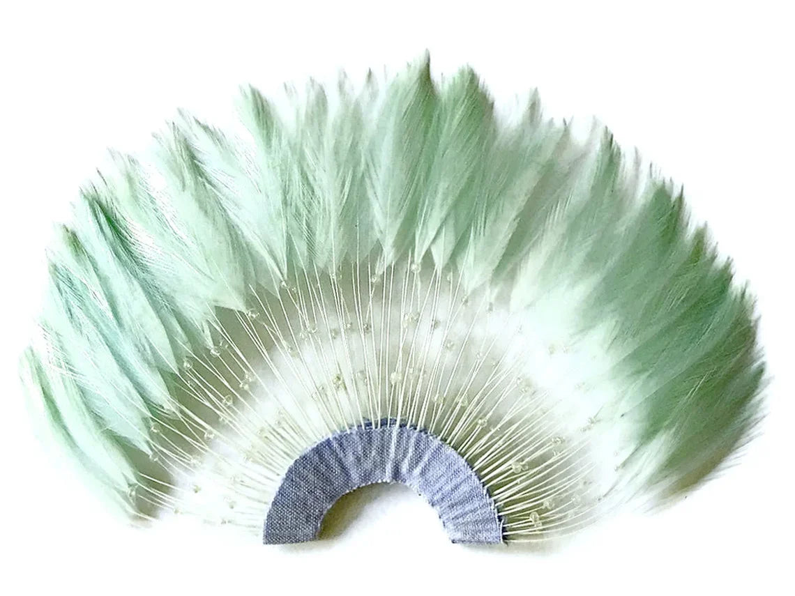 Mint green feather fan trim for DIY fashion and craft decorations.