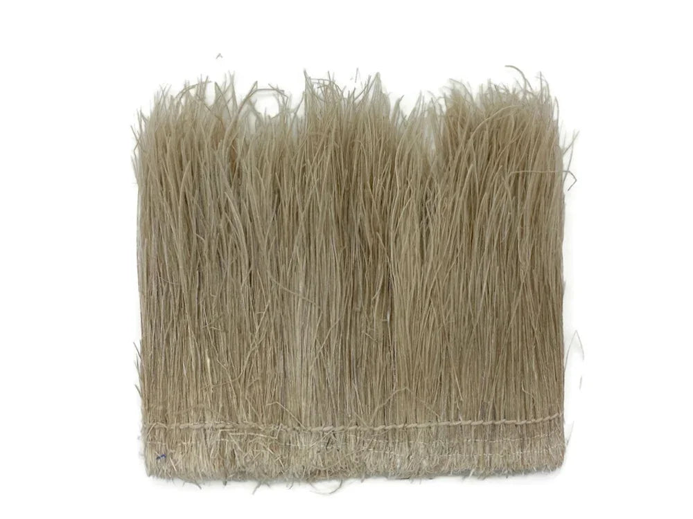 Natural beige straw fringe trim for DIY crafts and fashion accessories.