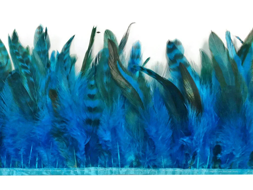 Vibrant blue and teal striped feathers for DIY crafts and fashion accessories.