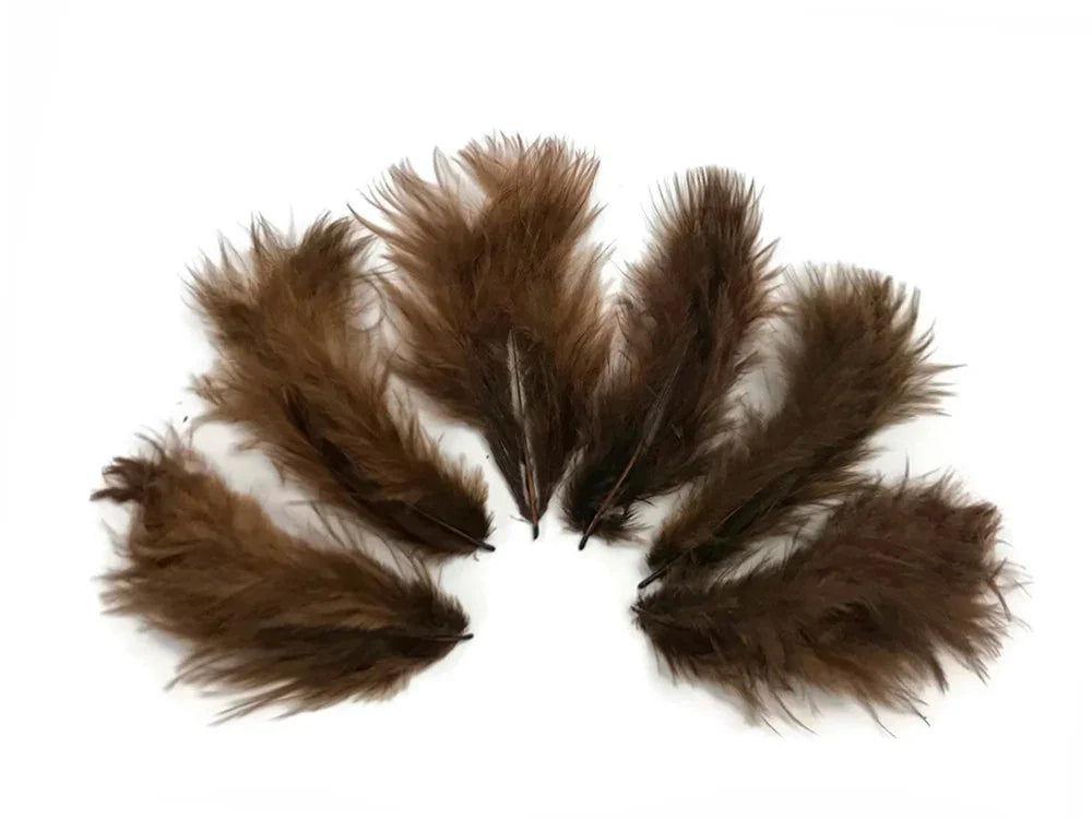Natural brown feathers for DIY crafts and fashion accessories on a white background