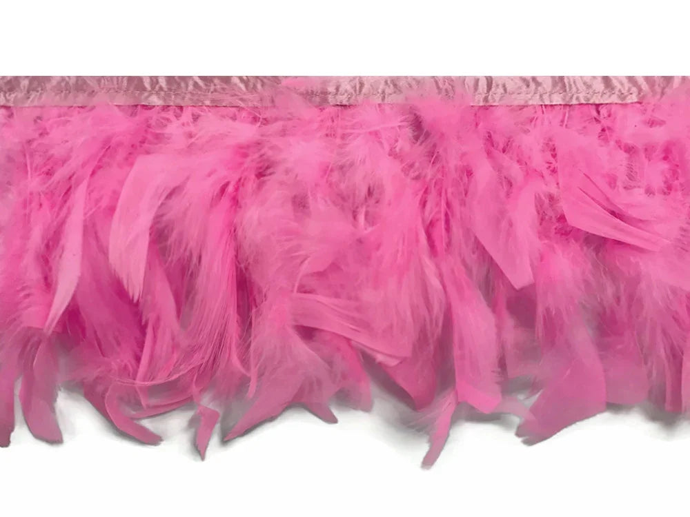 Vibrant pink ostrich feather boa trim for fashion and DIY crafts.