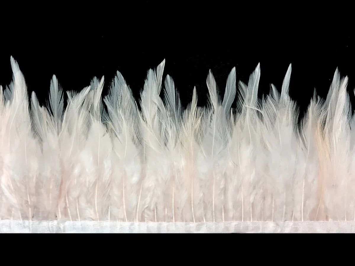 Soft white ostrich feather trim for fashion and DIY craft decorations.
