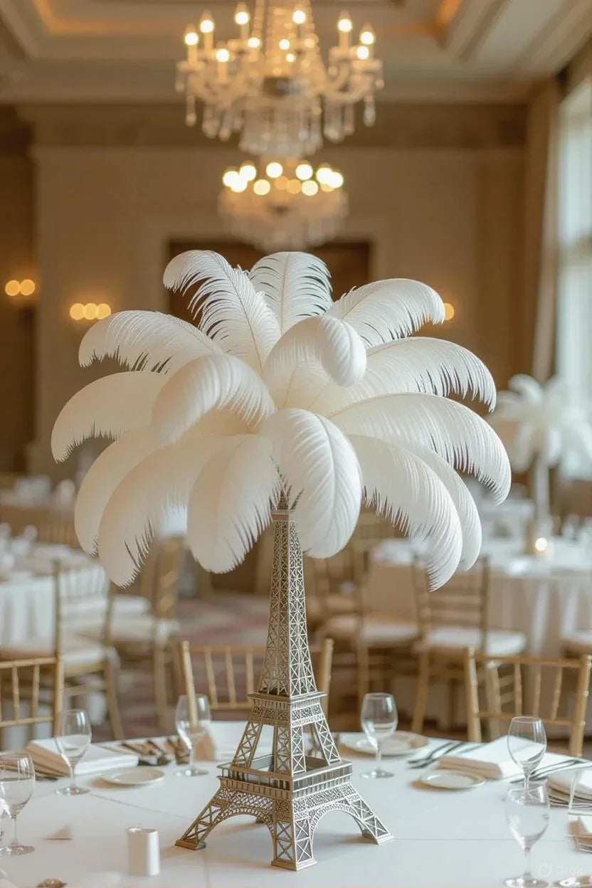 Elegant white ostrich feather centerpiece on a miniature Eiffel Tower for event decor