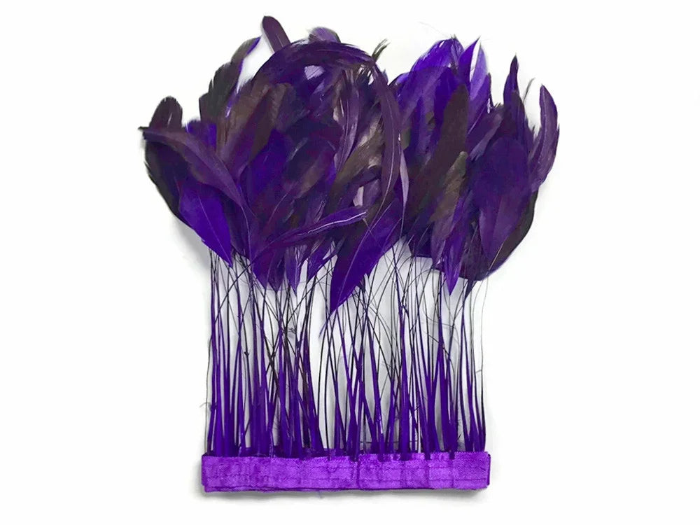 Vibrant purple feathers for DIY crafts and fashion accessories on a white background.
