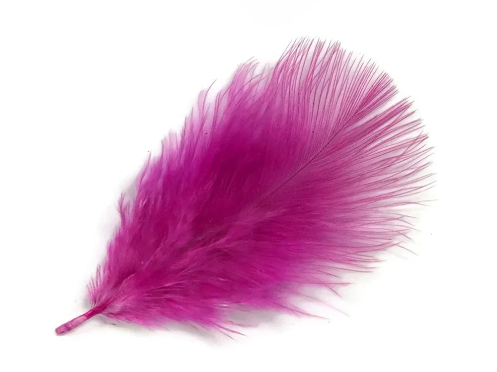 Vibrant magenta pink craft feather for DIY fashion and decor projects.