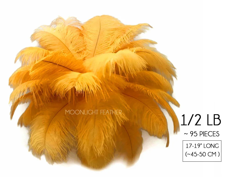 Bundle of 95 yellow ostrich feathers, 17-19 inches long, for crafts and fashion decor.