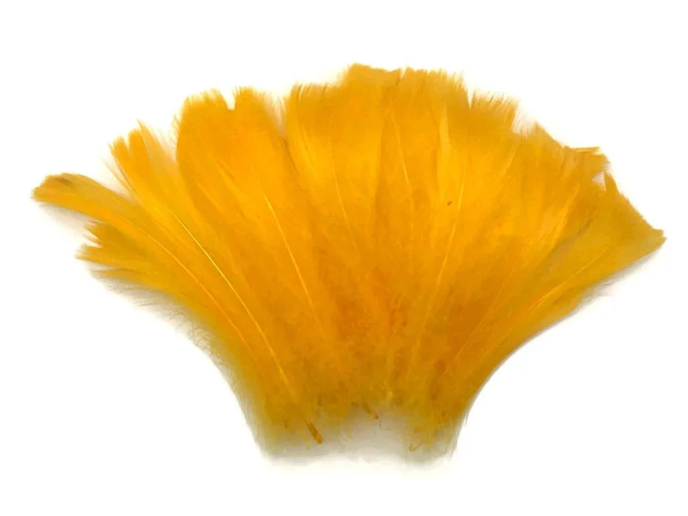 Vibrant yellow feathers for DIY crafts and fashion accessories on a white background.