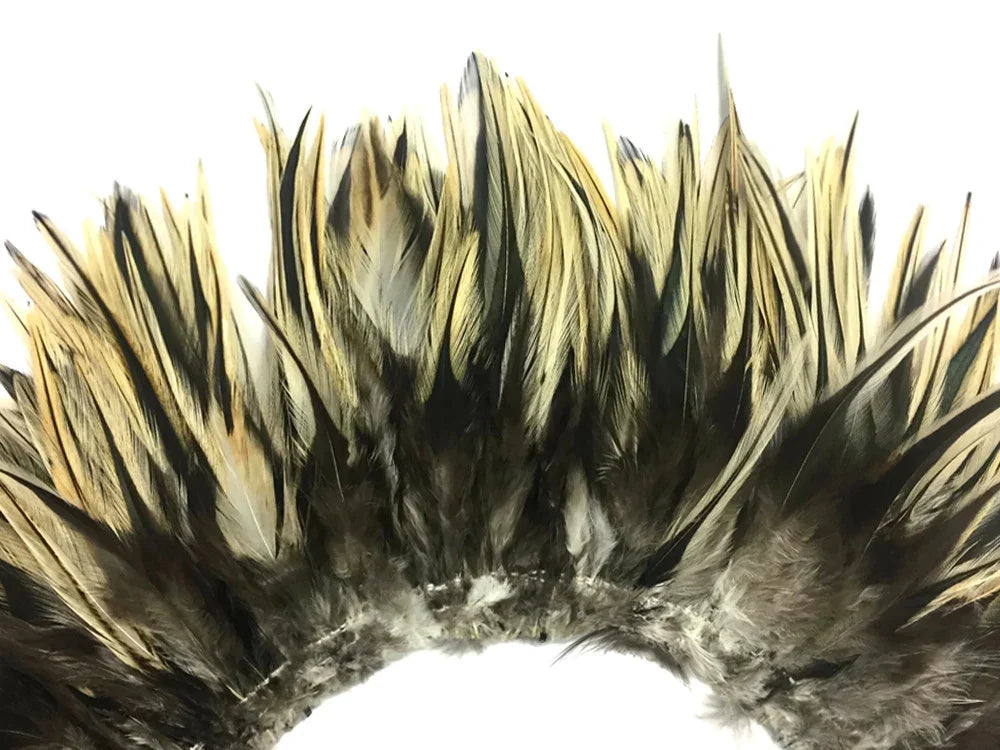 Natural brown and gold feathers arranged in a decorative crown for crafts and fashion.