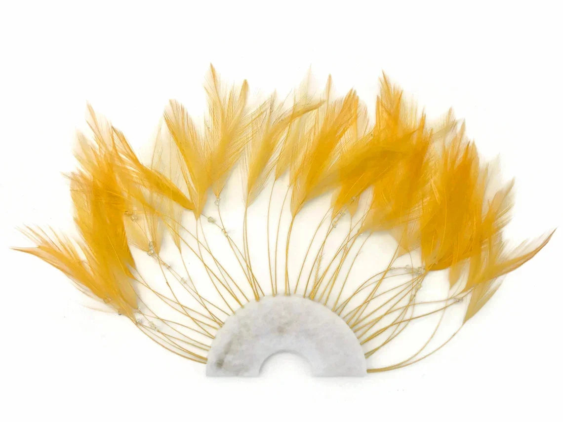 Vibrant yellow feathers arranged in a semi-circle fan shape for DIY crafts and fashion.
