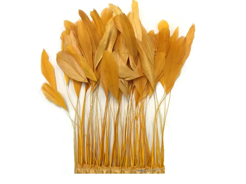 Natural golden yellow feathers with long stems for DIY crafts and fashion decor.