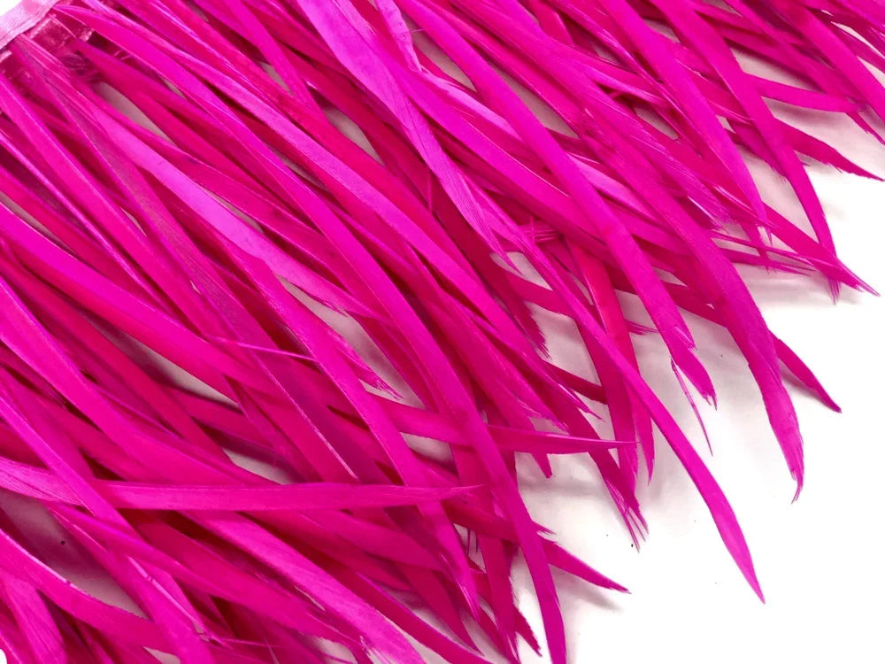 Vibrant hot pink dyed feathers for DIY crafts and fashion accessories.