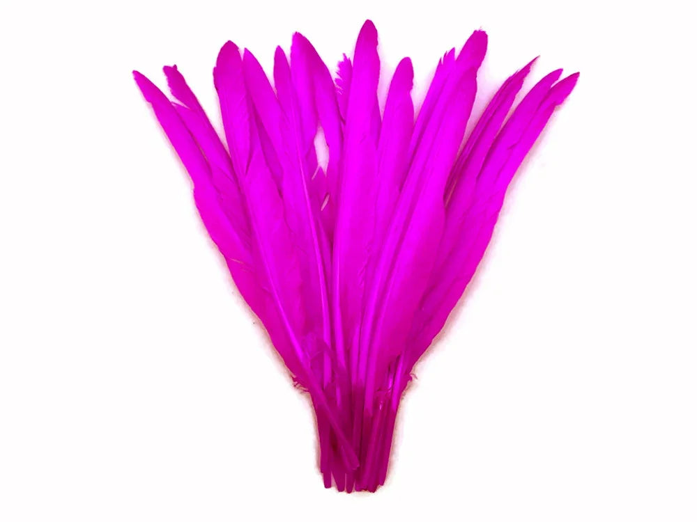 Vibrant magenta pink craft feathers for DIY fashion and decor projects.