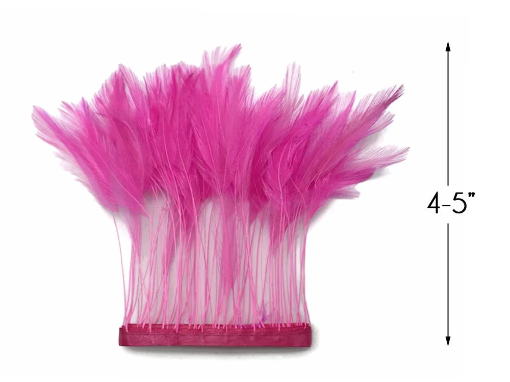 Vibrant pink feather trim accessory, 4-5 inches long, for fashion and DIY crafts.