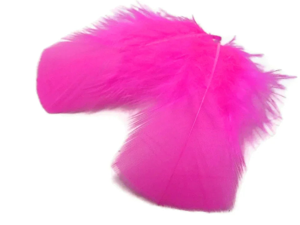 Vibrant bright pink feathers for DIY crafts, fashion accessories, and costume décor.