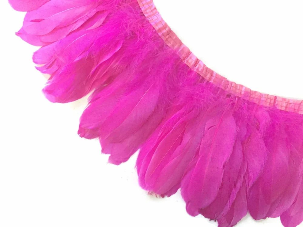 Vibrant hot pink feather trim for crafts and fashion accessories.