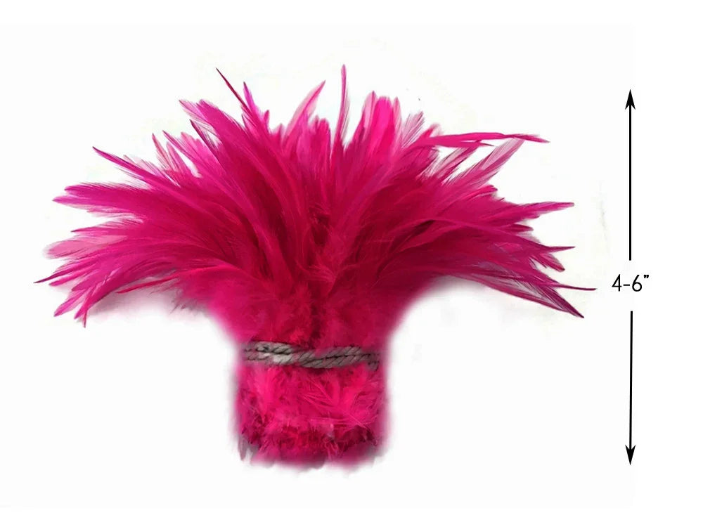 Vibrant hot pink feather plume for crafts and fashion decor, 4-6 inches long.