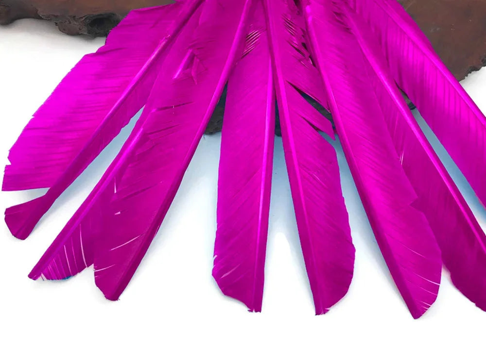 Vibrant magenta dyed feathers for DIY crafts and fashion accessories.