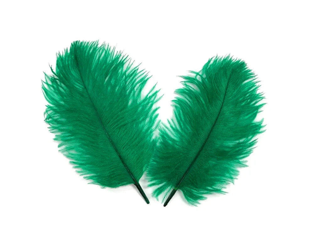 Two vibrant green decorative feathers for crafts and fashion DIY supplies on a white background.