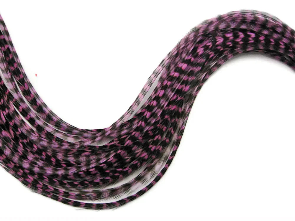 Pink and black patterned craft feathers for DIY fashion and decor accessories.