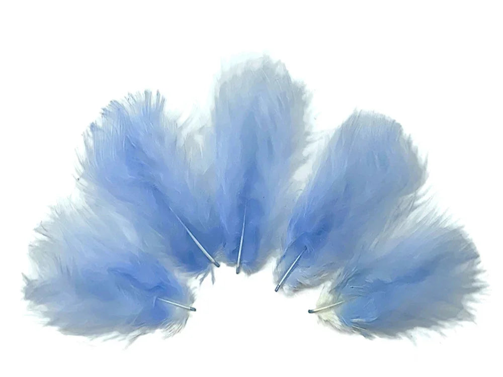 Set of soft light blue decorative feathers for crafts and fashion DIY supplies.