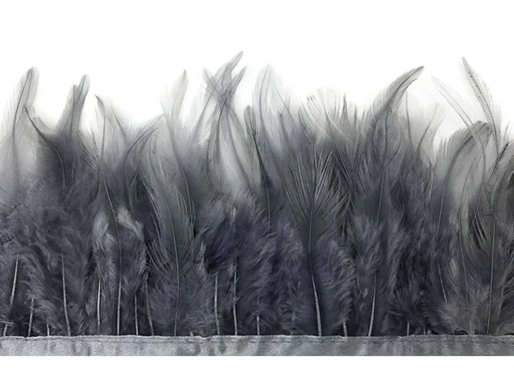Elegant grey ostrich feathers for fashion and DIY craft decorations on a white background.