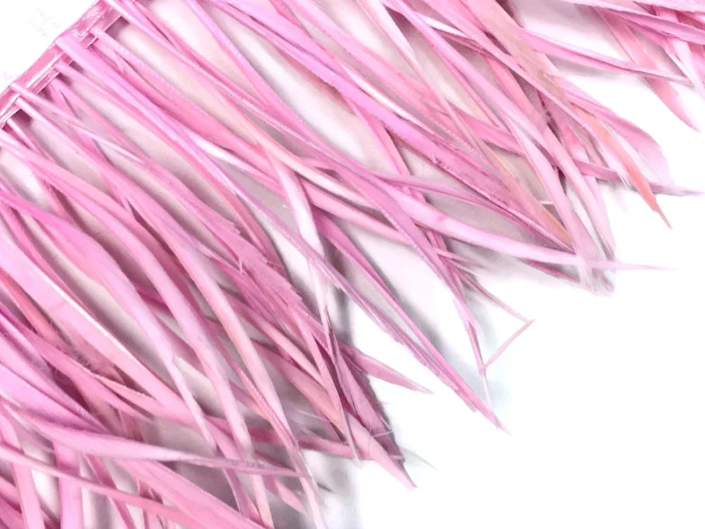 Soft pink craft feathers for DIY fashion and decorative accessories.