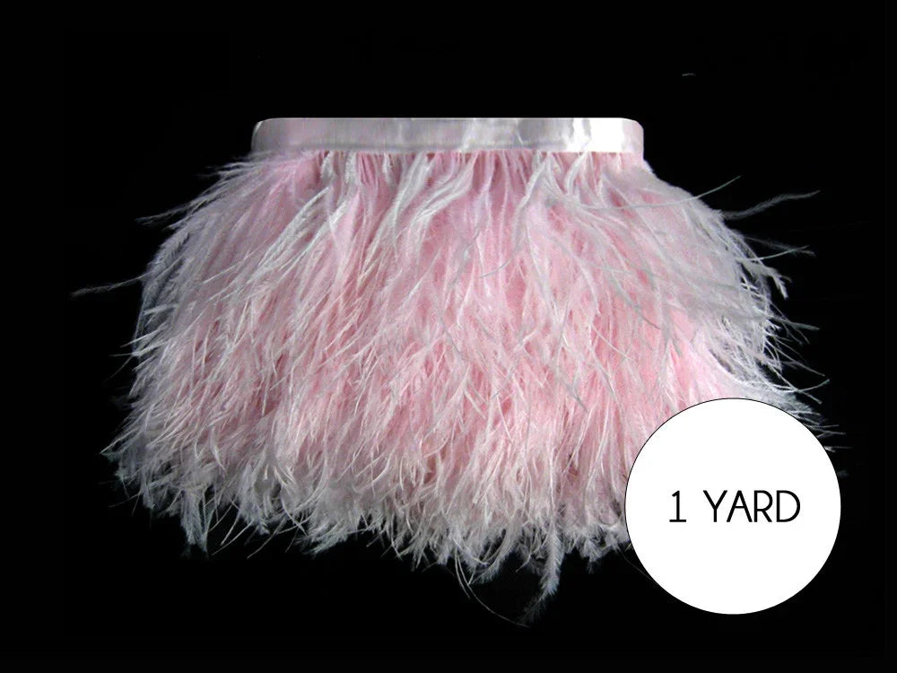 One yard of soft pink ostrich feather trim for fashion and DIY crafts.
