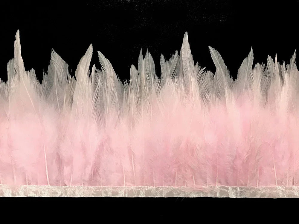Soft pink and white ostrich feather trim for DIY crafts and fashion décor.