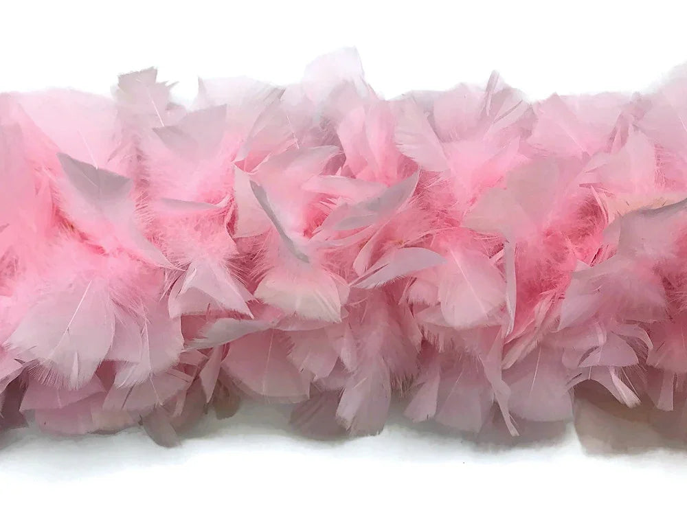 Soft pink feather boa for DIY crafts, fashion accessories, and party décor.