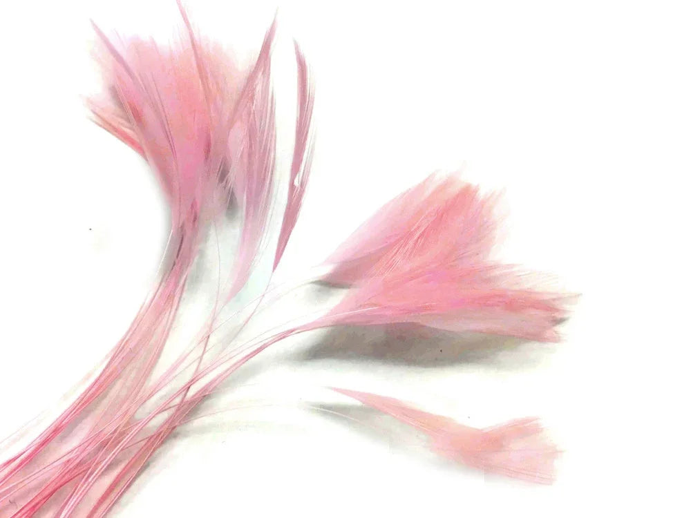 Soft pink decorative feathers for DIY crafts and fashion accessories.
