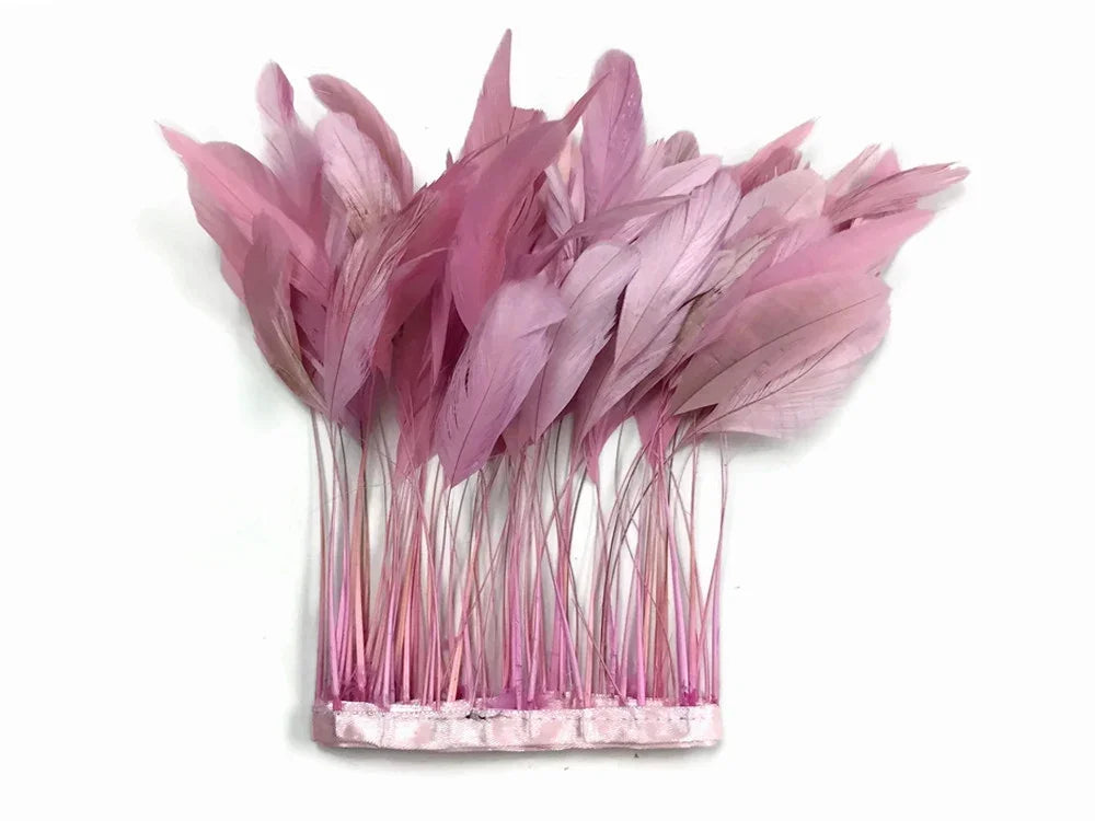 Pink dyed feathers for fashion accessories and DIY craft decorations.