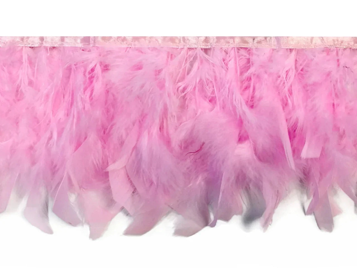 Soft pink feather boa trim for fashion crafts and DIY décor.