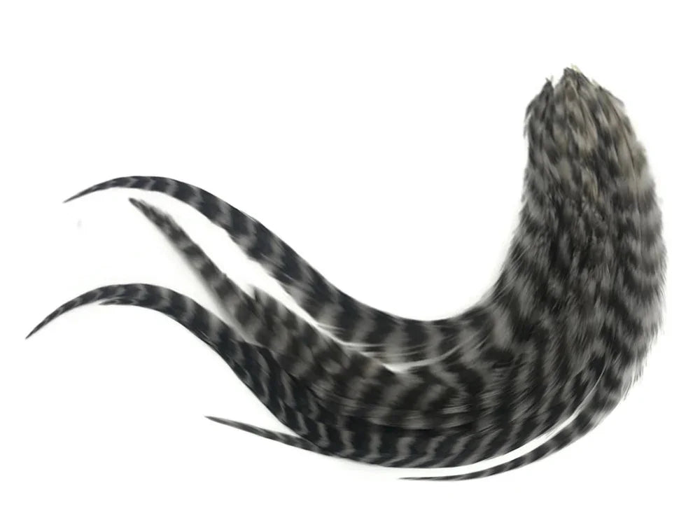 Black and white striped decorative feathers for crafts and DIY fashion decor.