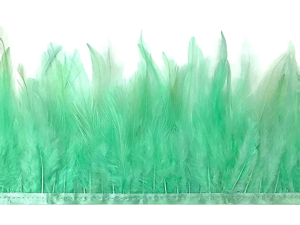 Vibrant mint green feather trim for fashion crafts and DIY décor projects.