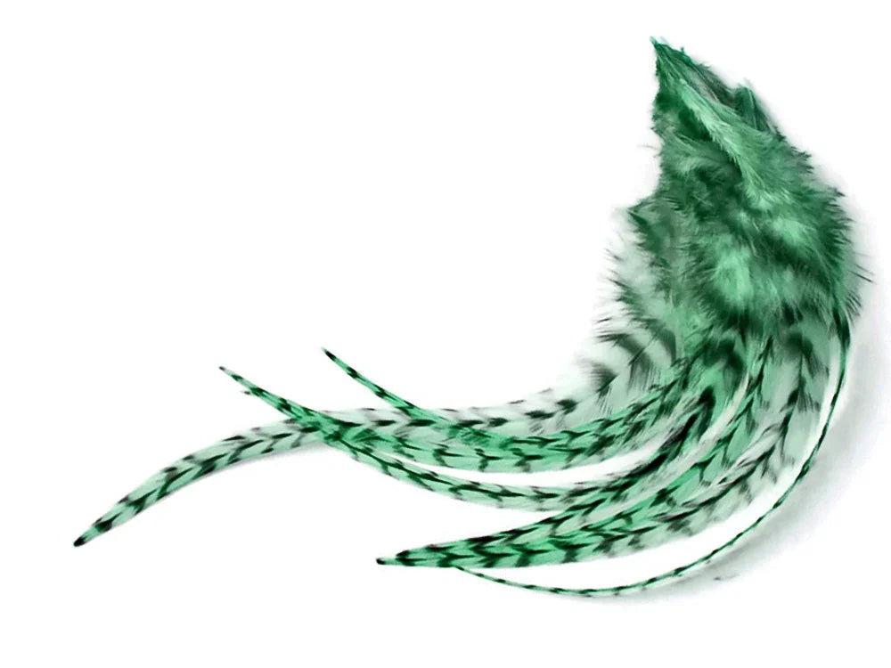 Vibrant green dyed feathers with black speckled patterns for DIY crafts and fashion decor.