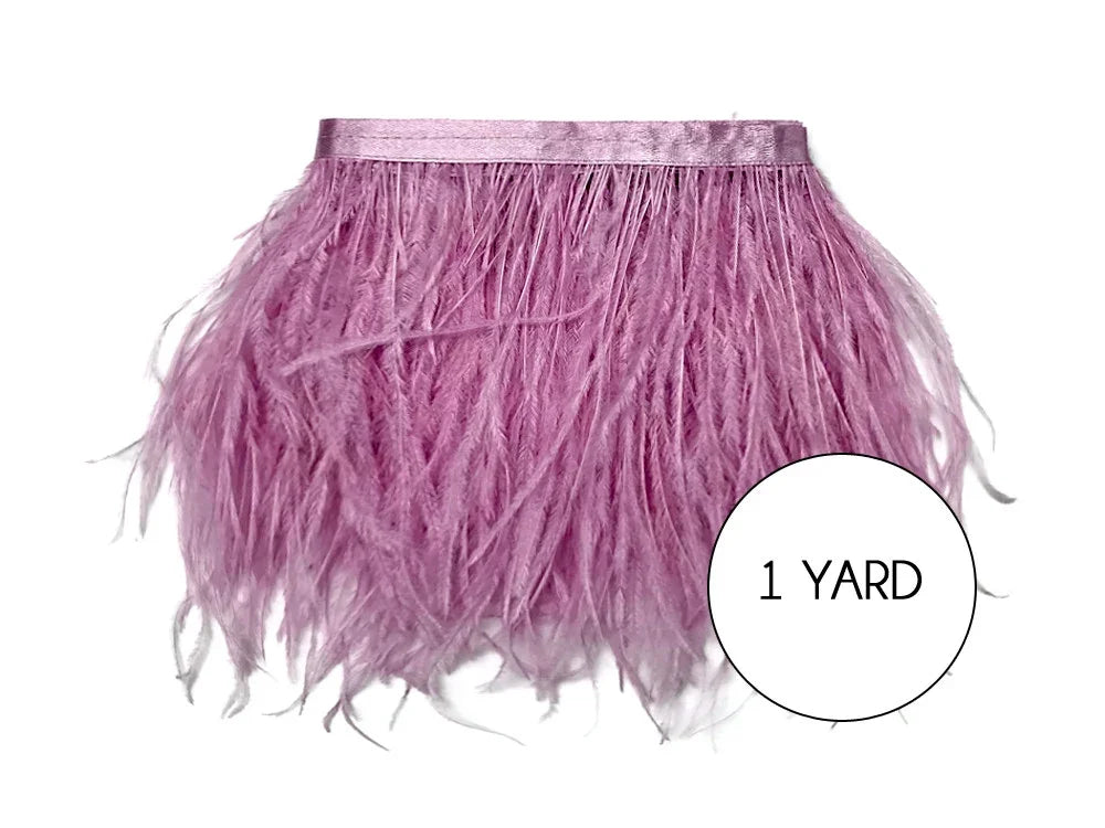 One yard of soft pink ostrich feather trim for fashion and DIY crafts.
