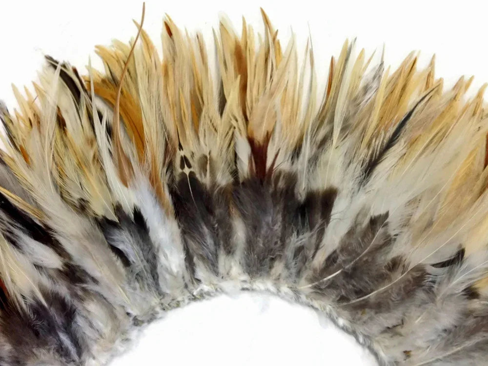 Natural brown and white decorative feathers for DIY crafts and fashion accessories.