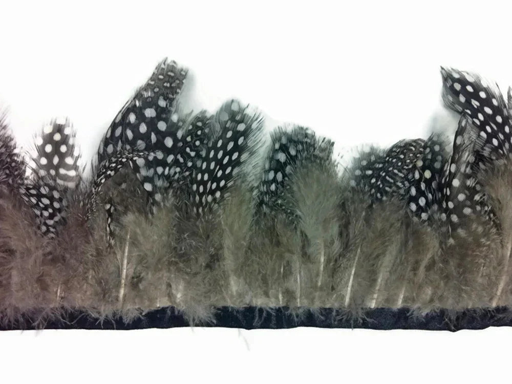 Black and white spotted feather trim on a dark fabric ribbon for crafts and fashion